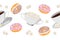 Seamless border of cups of tea, sugar bowl and donuts on a white background