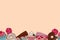 Seamless border with sweets donuts lollipop and cakes.