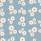 Seamless botanical ornament pattern with autumn small abstract doodle flowers in warm pastel colors isolated on blue background in