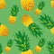 Seamless bright pineapple pattern on a green background. Design can be used for wallpaper