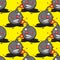 Seamless cartoon bomb pattern on yellow background. Vector image