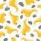 Seamless cartoon pattern with yellow dinosaurs and stones. Pattern on a white background for printing. Flat illustration.