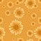 Seamless chamomile pattern with orange flowers on light orange background