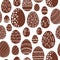 Seamless chocolate easter eggs pattern. Vector background.