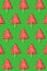 Seamless christmas pattern from sweet tree on green background