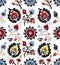 Seamless colored ethnic flowers and leaves pattern on white background. designed for textile prints.