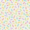 Seamless colourful sprinkles repeat pattern on a light background, birthday celebration theme