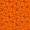 seamless contour pattern of graphic flying black ghosts on orange background