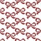 Seamless cross stitches bow pattern on white