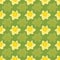 Seamless daffodils pattern on green background
