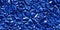 Seamless deep blue sapphire gem stone ore closeup background texture