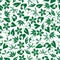 Seamless emerald green leaves and twigs pattern