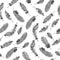 Seamless ethnic pattern with black feathers on white background.