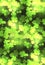 Seamless festive texture with a happy four-leaf clover