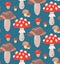 Seamless flat texture with mushrooms and amanita on a dark background. Cartoon pattern with fungus. Hand drawn wallpaper