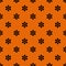 Seamless floral ditsy Halloween pattern with small black daisies flowers on orange background. Elegant holiday print for fabric