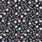 Seamless floral ditsy pattern in country style. Small berries, flowers and leaves isolated on black background.