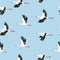 Seamless flying stork birds pattern. Vector illustration
