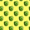 Seamless food pattern. Green sweet bell pepper on a yellow background. Vegetable, healthy ingredient. Bulgarian paprika