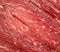 Seamless fresh meat background. Raw uncooked red beef meat texture. Closeup pattern