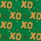 Seamless gingerbread XO phrase cookie. Christmas kiss and hug. Pattern,green background. Festive homemade sweets. Vector