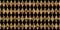 Seamless golden diamond harlequin checker pattern. Vintage abstract gold plated relief sculpture on black background