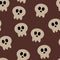 Seamless halloween pattern with cartoon skulls, chocolate background