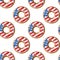 Seamless Independence Day pattern with donuts with American flag pattern in honor of 4th of July. Volumetric symmetrical 3D donuts