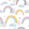 Seamless kids pattern with doodle pastel rainbows, hearts, dots and clouds