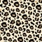 Seamless leopard pattern in vector. Brown spots, imitation of wild animal fur on a beige background