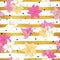 Seamless lily flowers pattern on gold striped background