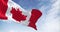 Seamless loop in slow motion of Canada national flag waving on a clear day