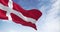 Seamless loop in slow motion of Denmark national flag waving on a clear day