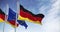 Seamless loop in slow motion of Germany and the European Union flags waving