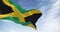 Seamless loop in slow motion of Jamaica national flag waving on a clear day