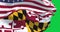Seamless loop in slow motion of Maryland and the US flags waving on green screen
