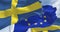 Seamless loop in slow motion of the national flag of Sweden waving in the wind with blurred european union flag in the background