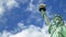 Seamless loop - Statue of liberty blue sky with moving clouds, HD video