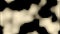 Seamless looped background of black and beige illuminated pixel waves. Design. Black stains resembling a cow print.