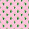 Seamless looping pattern with a transparent glass of green drink on a pastel pink background. hard shadows from the sun at noon