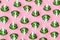 Seamless minimalistic pattern with broccoli on a pink background.