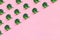 Seamless minimalistic pattern isometric with broccoli on a pink background.
