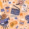 Seamless movie pattern with cinema items. Endless background with film tape, camera, projector, clapperboard