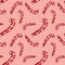 Seamless New Year pattern with a lollipop. Christmas print painted in watercolor. The pattern is perfect for wrapping paper. Pink