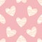 A seamless pastel pink background with funky hearts in red and white