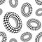 Seamless pattern of 3D geometric checkered rounded shapes. Donuts. Black and white colors