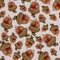 Seamless pattern of acorns of different sizes isolated on a green background