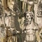 Seamless pattern of ancient statues of a muscular man with a beard and beautiful woman over the rock wall.
