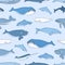 Seamless pattern with aquatic animals or marine mammals hand drawn on blue background - whales, narwhal, dolphins