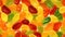 Seamless pattern of assorted jelly gum fruit candy top view flat lay